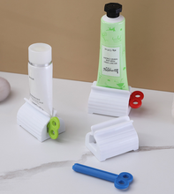 Load image into Gallery viewer, Rolling Tube Toothpaste Squeezer Dispenser