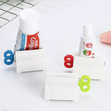 Load image into Gallery viewer, Rolling Tube Toothpaste Squeezer Dispenser
