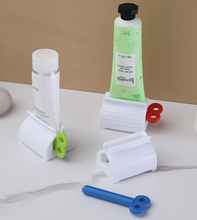 Load image into Gallery viewer, Rolling Tube Toothpaste Squeezer Dispenser
